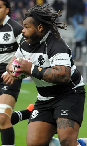 Barbarians Rugby Barbarians player takes the ball and faces the opposition