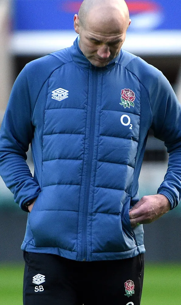 England coach keeping warm in his Umbro jacket during a 6 Nations match