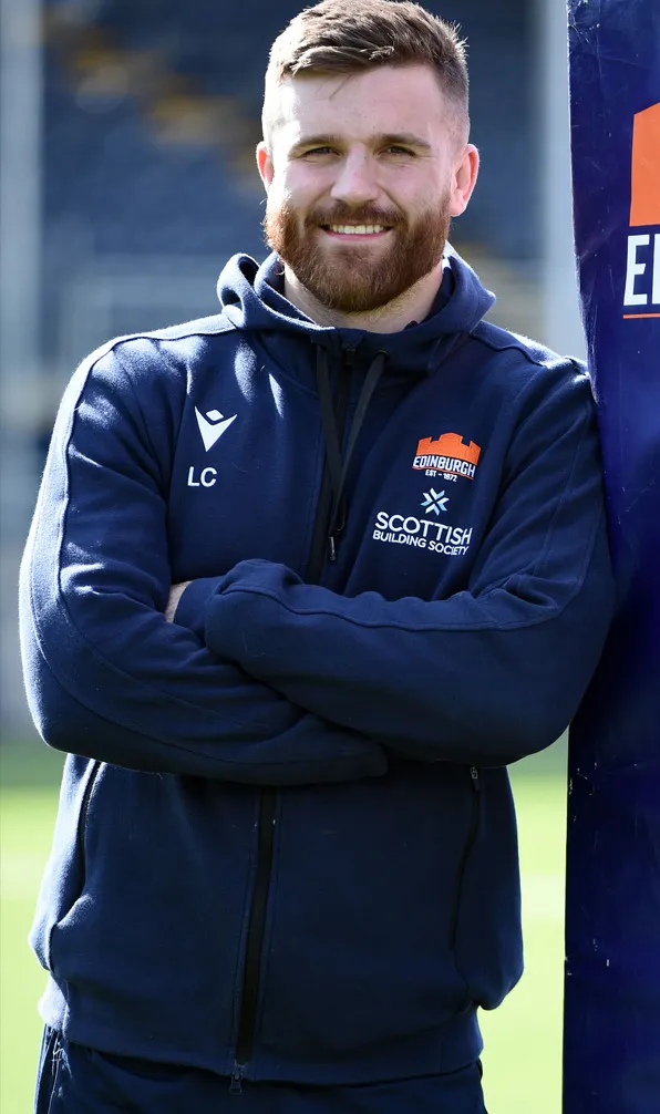 Pro Clubs Hoodies & Sweatshirts Edinburgh Rugby Player smiles for the camera at Murrayfield wearing an Edinburgh Rugby hoodie