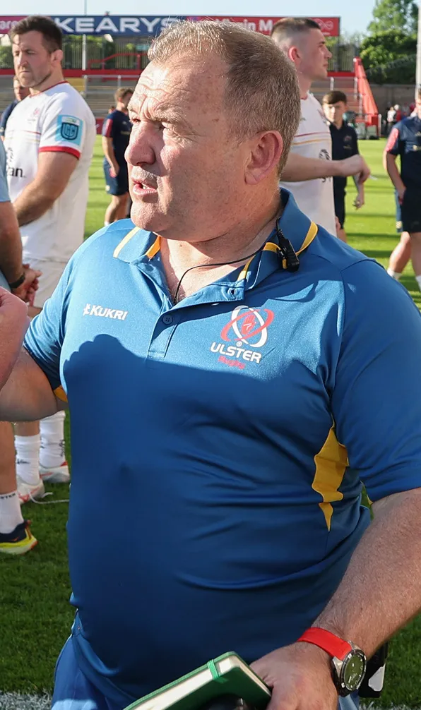 Pro Clubs Polo Shirts Professional Ulster coach talks to supporters during a match wearing the team polo shirt
