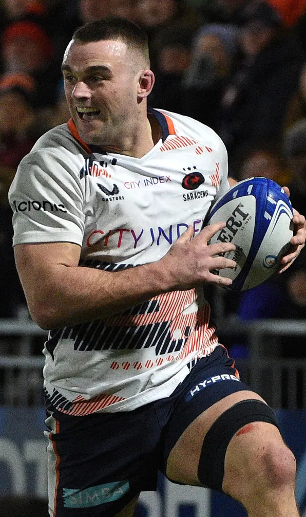 Saracens Rugby Saracens rugby player runs excitedly with the ball during a rugby match