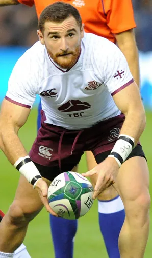 Georgia Rugby Georgian rugby player gets down low to avoid a tackle against Scotland in the Summer Tests