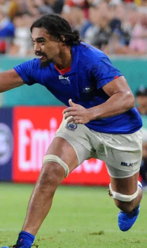 Samoa Rugby Samoan player reaches for the ball during a rugby game