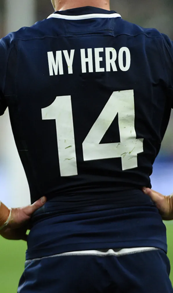 Back of a rugby player's shirt with the words 'My Hero' across the shoulders