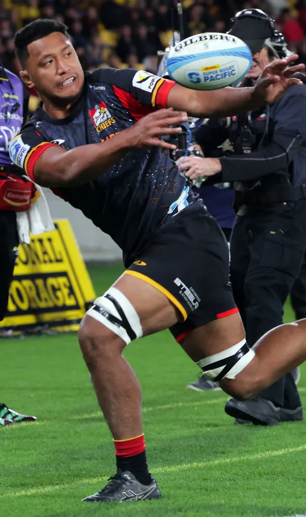 Shop Chiefs Now Chiefs player passes just before going out of bounds during Super Rugby match