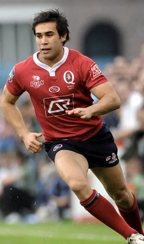 Shop Queensland Reds Image of Queensland Reds player chasing down a ball